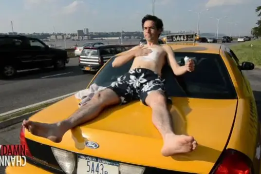 Mark Malkoff, catching some rays on his taxi